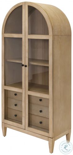 an arched wooden cabinet with drawers and shelves