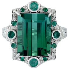 This ring is crafted from 18-karat gold. It is hand set in 9.87 carats tourmaline, .38 carats emerald and .80 carats of glittering diamonds. The ring is a size 7 and may be resized to larger or smaller upon request. FOLLOW MEGHNA JEWELS storefront to view the latest collection & exclusive pieces. Meghna Jewels is proudly rated as a Top Seller on 1stDibs with 5 star customer reviews. All items manufactured by us are handmade and can be customized or redesigned. Composition Total Weight-9.237 Gold Jewerly Ring, Yellow Gold Cocktail Ring, Contemporary Engagement Rings, Expensive Jewelry Luxury, Modern Engagement Rings, Contemporary Ring, Expensive Jewelry, Luxury Rings, Fine Rings