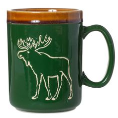 a green coffee mug with an image of a moose on it