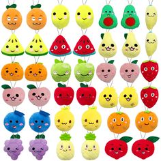 various fruits and vegetables with faces on them are hanging from clothes pins in different colors