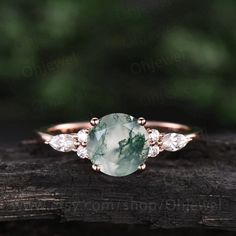 "This is a moss agate engagement ring in solid gold,about 7mm round cut. The accent stones are round 1.5mm and marqueise 2x4mm moissanites. It can be made in any ring size. However please contact me to custom make it to a special big or small size. It can be made in white gold,rose gold or yellow gold with 14k or 18k. However for some people who are nickel allergic,I can also make it to 925 sterling silver to make you can wear it. The ring is handmade,very high quality! 30 days money back guaran Delicate Rose Gold Moissanite Jewelry, Timeless Rose Gold Moissanite Jewelry, Timeless Moissanite Rose Gold Jewelry, Cubic Zirconia Gemstone Jewelry For Promise, Cubic Zirconia Promise Jewelry With Gemstone, Heirloom Style May Birthstone Jewelry For Promise, Elegant Moissanite Promise Ring Jewelry, Elegant Moissanite Jewelry For Promise Ring, Exquisite Jewelry With Round Gemstones