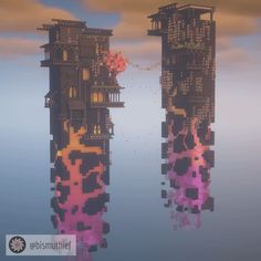 two tall buildings in the water with trees on each side and clouds reflected in the water