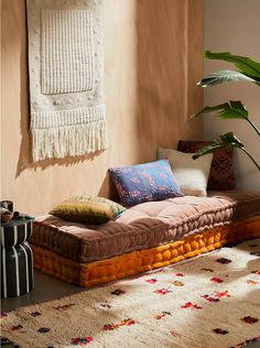 a living room filled with lots of furniture and decor on top of a carpeted floor