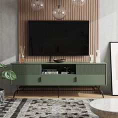 a living room with a large television mounted on the wall and a rug in front of it