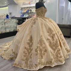 SPECIFICATIONS Material: COTTON Fabric Type: Tulle Pattern Type: Floral Age-targeted: All age Neckline: SWEETHEART Sleeve Length(cm): short Dresses Length: Floor-Length Style: Exquisite Actual Images: Yes Origin: Mainland China CN: Jiangsu is_customized: Yes Decoration: Appliques Decoration: Beading Decoration: CRYSTAL Decoration: FLOWERS Decoration: RUFFLES Decoration: Sequined Decoration: Pleat Built-in Bra: Yes Occasion: Quinceanera Item Type: Quinceanera Dresses Fashion Element: Candy Color Gold Fitted Dress For Quinceanera, Gold Ball Gown Dress For Quinceanera, Fitted Gold Dress For Quinceanera, Princess Style Gold Gown For Quinceanera, Gold Princess Dress For Quinceanera, Gold Princess Gown For Quinceanera, Princess Gold Gown For Quinceanera, Gold Princess Gown For Prom Season, Gold Princess Gown For Prom