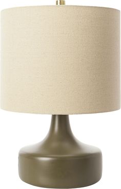 a table lamp with a beige shade on it