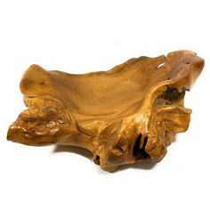 a wooden bowl that is shaped like a tree trunk