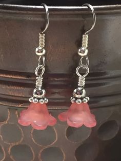 These earrings will be adorable hanging from any ear lobes. They are very lightweight. The pink flower is frosted acrylic which makes the earrings super cute.Earrings are made using surgical steel ear wires. I use wrapped loops to give a finished look. Earrings come with rubber ear backs that slide on to keep earrings from falling out of ears.TO SEE MORE EARRINGSCLICK HEREORDERS PROCESS AND SHIP IN 1-3 BUSINESS DAYS. Large orders could take up to 4 days to process. See shipping policy for detail Pink Dangle Flower Charm Earrings, Pink Dangle Flower Earrings Nickel Free, Nickel-free Pink Dangle Flower Earrings, Pink Adjustable Dangle Flower Earrings, Cute Pink Flower Earrings With Ear Wire, Pink Flower Earrings With Ear Wire, Pink Flower Earrings With Adjustable Ear Wire, Pink Adjustable Flower Earrings With Ear Wire, Adjustable Pink Flower Earrings With Ear Wire