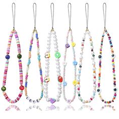 PRICES MAY VARY. Beaded Lanyard for Phone: There are 6 pieces of beaded mobile phone lanyard. The exquisite mobile phone chain is equipped with clay beads, evil eye, fruit, flower and ''LOVE'' letter. The random combination of a variety of beads can meet the color matching requirements of your different mobile phone cases, and you can easily match them with your clothes. Use: The hand strap is strong enough to withstand items such as cell phones, wallets,cameras, mp3, keychains, id cards, u disk Mobile Charms, Beaded Phone Lanyard, Keychain Beads, Beaded Mobile, Star Pearl, 90s Clothes, Rainbow Pearl, Beaded Lanyard, Phone Lanyard