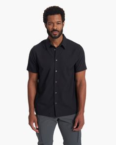 Light, stretchy and smooth on the skin, our performance woven shirt combines a tailored shape with endless wearability, made from 100% recycled fabric. This short-sleeved button down is designed for days when you want to look and feel like a premium feature. | Vuori Short Sleeve Manhattan Button Down | Black | Medium Vuori makes premium performance apparel inspired by the active Coastal California lifestyle; an integration of fitness, surf, sport, and art. Breaking down the boundaries of traditi Black Shorts Men, Coastal California, California Lifestyle, California Coastal, Performance Outfit, Recycled Fabric, Black Media, Black Shorts, Boundaries