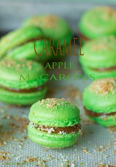 green macarons with caramel on top and sprinkles in the middle