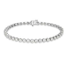 Shine bright from all angles with this dazzling, round brilliant diamond tennis bracelet. Set in a classic 3-prong settings, this design adds effortless luxury to almost any look. Classic Tennis Bracelet In Diamond White With Diamond Cut, Classic Diamond Tennis Bracelet With Accents, Classic Diamond Bracelets With Prong Setting, Classic Diamond White Tennis Bracelet, Classic Tennis Bracelet With Single Cut Diamonds, Timeless Diamond Tennis Bracelet, Timeless Diamond White Tennis Bracelet With Prong Setting, Classic Diamond Bracelet With Prong Setting, Timeless Diamond Tennis Bracelet With Round Cut