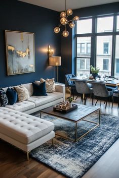 a living room filled with furniture and a large painting on the wall over a table