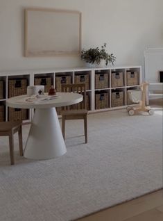 a living room filled with furniture and white walls