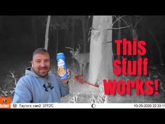 a man holding up a can of beer in front of a tree with the caption'this stuff works '