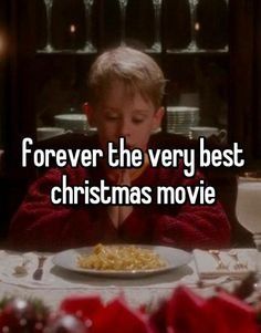 a young boy sitting at a table eating food with the words forever the very best christmas movie