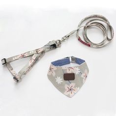 a dog collar and leash set on a white surface with a lanyard attached to it