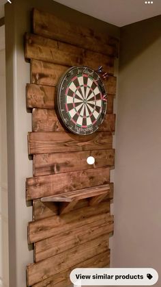 a wooden wall mounted to the side of a wall with a dart on top of it