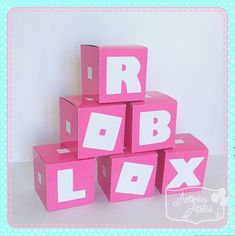 pink blocks with white letters are stacked on top of each other