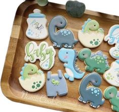 baby shower cookies are arranged on a tray