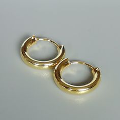 16 mm sterling silver endless ear hoops, dipped in gold. Size: 3 x 16 mm These earrings are made of real 925 hypoallergenic sterling silver, dipped in real gold. Will be packaged in a gift box. Please let me know if you don't want it in one. I can write out a message from you to the receiver if needed. Please be free to contact me at... bhavnakwintra1956@gmail.com More hoops: https://www.etsy.com/your/shops/TheSilverGame/tools/listings/section:26305414 More earrings: https://www.etsy.com/your/sh Simple Gold Small Hoop Huggie Earrings, Simple Gold Huggie Jewelry, Simple Huggie Jewelry, Minimalist Small Hoop Earrings Cadmium-free, Simple Gold Huggie Hoop Earrings, Gold Circle Huggie Earrings For Everyday, Everyday Gold Circle Huggie Earrings, Simple Round Gold Huggie Earrings, Jewelry Casual