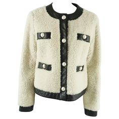 This Moschino Cheap & Chic ivory shearling jacket (sheep fur from Spain) and is fully trimmed in 1.75" black leather trim throughout the jacket with 4 large pearl buttons down the front of the jacket. The jacket has 2 front top faux pockets with pearl buttons and the leather trim, 2 real pockets with pearl buttons and leather trim and the entire jacket has a leather lining. The piece is in excellent condition with very light wear. Measurements Sleeve Length: 25.5" Shoulder to Shoulder: 17.6" Len Chic Jacket, Moschino Cheap And Chic, Black White Fashion, Pearl Buttons, Shearling Jacket, White Fashion, Moschino, Leather Trims, Faux Pearl