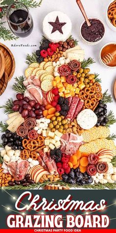 a christmas tree made out of crackers, cheeses and other food on a table