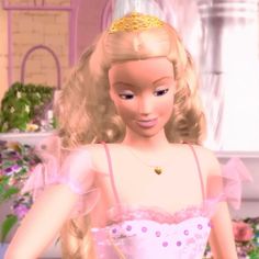 the barbie doll is wearing a pink dress