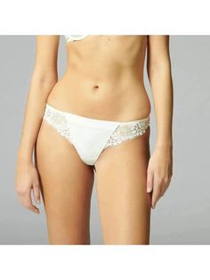 Simone Perele Wish Tanga Panty 12B710 in ivory color - front Elegant Stretch Lace Bottoms, Elegant Lace Bottoms With Lace Trim, Elegant Bottoms With Delicate Lace And Stretch, Wedding Bottoms With Lace Trim String Shape, Elegant Stretch Bottoms With Delicate Lace, Elegant Lace Trim Brief Bottoms, Elegant String Bottoms With Contrast Lace, Feminine Fitted Bottoms With Contrast Lace, Elegant White Bottoms With Lace Trim