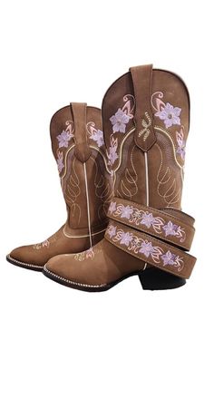 These beautiful embroidered women boots are crafted from the highest quality leather. The classic silhouette is perfect for pairing with jeans or dresses, and the intricate detailing adds a touch of sophistication to any outfit. They feature a comfortable mid-height heel and a cushioned insole for a comfortable fit. Whether you're looking for a statement piece or an everyday staple, these boots are sure to become a wardrobe staple. Fall Floral Embroidery Snip Toe Boots, Western Style Embroidered Boots For Festival, Embroidered Snip Toe Boots For Festival, Western Embroidered Boots For Festivals, Brown Embroidered Closed Toe Boots, Mexican Boots For Women, Brown Boots With Floral Embroidery And Round Toe, Western Style Embroidered Boots With Round Toe, Wedding Cowboy Boots For Bride