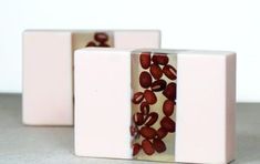 two white blocks with red beans on them