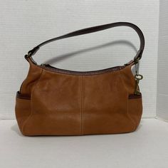 Fossil || Woman’s Tan Leather Shoulder Bag Exterior Side Pockets 2 Interior Pockets 1 Interior Zip Pocket In Great Condition Never Worn But It Have Some Mall Stains From Been In The Closet But They Are Hard To See On The Inside Like New In Perfect Condition Please Check Pictures Before Your Purchase Bundle And Save On Shipping Measurements Length Across 14 Inches Width 4 Inches Height 7 Inches Strap From Hem To Hem 16 Inches Bundle And Save On Shipping Tan Satchel Shoulder Bag With Zipper, Tan Satchel Shoulder Bag With Zipper Closure, Casual Bags With Gold-tone Hardware For Errands, Elegant Tan Shoulder Bag With Zipper, Tan Bags With Zipper Closure For Errands, Casual Shoulder Bag With Gold-tone Hardware For Errands, Formal Tan Bag With Zipper Closure, Casual Leather Shoulder Bag With Gold-tone Hardware, Tan Hobo Bag For Travel