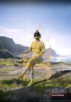 a man dressed in yellow is standing on some rocks