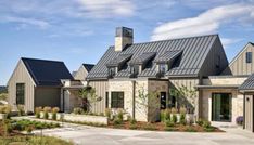 a large house with two story houses on the front and one story home on the back