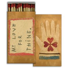 an old match box with matches in it and a hand that says i love you