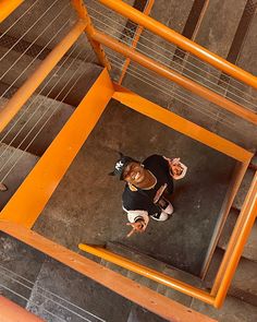 an overhead view of a woman standing on stairs