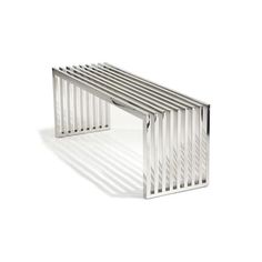 a metal bench sitting on top of a white floor