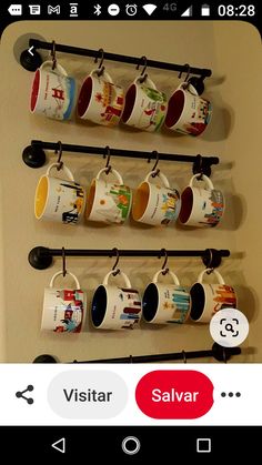 coffee mugs are hanging on the wall