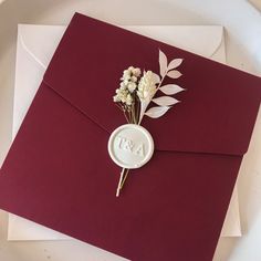 a red envelope with some flowers on it