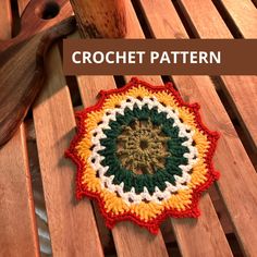 a crochet pattern on top of a wooden bench