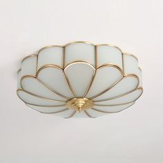 a white and gold chandelier hanging from the ceiling