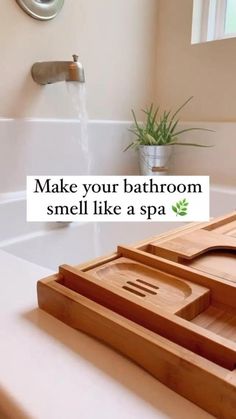 a wooden tray sitting on top of a bath tub