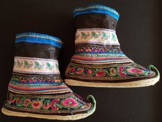 Beautiful embroidered handmade Miao boots from Yunnan Province, Southwest China. Silk and gold thread hand embroidery on black silk lower part of boot with cotton and silk upper sections. Cloth soles show some signs of wear, but boots are in great condition. Height: 22cm (8.8") Length: 25cm (9.84") Embroidered Winter Festival Boots, Winter Festival Embroidered Boots, Traditional Embroidered Festival Boots, Traditional Multicolor Embroidered Boots, Traditional Embroidered Boots For Festival, Traditional Black Embroidered Boots, Traditional Hand-stitched Boots With Round Toe, Traditional Handmade Round Toe Boots, Traditional Boots With Floral Embroidery And Round Toe