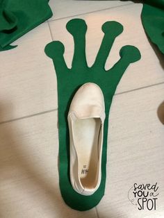 a pair of white shoes sitting on top of a floor