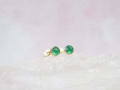 Genuine Emerald Stud Earrings - Natural Emerald Earrings - Small Stud Earrings - Dainty Stud Earrings - Simple Stud Earrings This dainty pair of Emerald Stud Earrings is simple yet elegant.  Emerald is known for encouraging growth, reflection, peace, and balance. Emerald is the birthstone for the month of May and makes a lovely birthday gift. --------------------------------- ALL EMERALD JEWELRY  https://etsy.me/3cu0zhc ALL EMERALD EARRINGS https://etsy.me/3oOcFaz BIRTHSTONE EARRINGS https://etsy.me/3x5L5JE ------------- MATERIAL 4mm Genuine Emerald Stone is Rose Cut Available in Sterling Silver, Gold Filled and Solid 14K Gold -------------------------- PROCESSING TIME 1-3 Business Day(s) Click Shop to See More Semi-precious Stones Available: Garnet (January) Amethyst (February) Aquamarine List Inspiration, Emerald Stud Earrings, Peace And Balance, Small Stud Earrings, Emerald Earrings Studs, Simple Stud Earrings, Birthstone Earrings, Dainty Studs, Earrings Simple