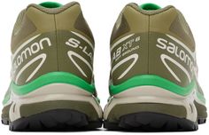 The Salomon Khaki & Green XT-6 sneaker is the perfect outdoor-inspired shoe for your active lifestyle. Featuring lightweight SensiFit mesh and a durable bonded trim throughout, these kicks were made for comfortably exploring nature-filled feeds. The Quicklace closure and padded collar provide a custom locked-in fit, while the OrthoLite insole and mesh lining keep feet fresh all day. With the Agile Chassis rubber midsole and grippy Contagrip outsole, you'll feel steady on any terrain. In trendy khaki and green tones made to match your hike and explore Instagram aesthetic, these Salomon sneakers allow you to soak up the sights in sustainable style. Green High-top Running Shoes With Laces, Green High-top Running Shoes For Light Sports, Green High-top Running Shoes, Green Low-top Functional Running Shoes, Green Low-top Trail Running Shoes For Light Sports, Functional Green Sneakers With Laces, Green High-top Trail Running Sneakers, Green High-top Sneakers For Trail Running, Green Breathable Sneakers For Light Sports