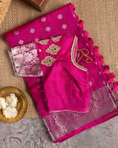 "Color : Pink and Silver Zari. Kanchipuram silk saree in pink donning shimmering silver appliques and border, paired with a self-colored blouse embroidered with silver zari and bead work. This saree is for sure to look even more stunning when worn for any occasion.  This saree is very easy to drape and falls elegantly making it so effortless to carry around. *Fall, Pico & Tassels : Done *Condition : New Saree With Stitched Blouse with Maggam work *Ready to Wear *Dry Clean Only Blouse:  Zardosi H Pink Tissue Silk Blouse With Traditional Drape, Festive Silver Blouse Piece With Zari Work, Festive Silver Blouse Piece For Festivals, Festive Silver Blouse Piece, Pink Dori Work Chandbali Saree, Festive Silver Saree Blouse Piece, Festive Pink Tissue Silk Blouse Piece, Festive Pink Pre-draped Saree With Motifs, Festive Tissue Silk Blouse For Celebration