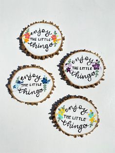 three embroidered badges with words on them that say enjoy the little things and enjoy the little things