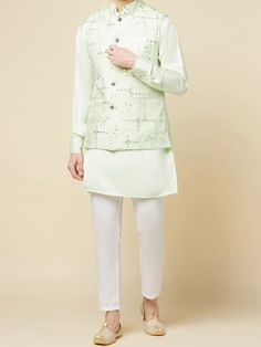 This Mint Green Kurta Bundi Jacket Set will instantly give an elegant look. This 3 piece kurta bundi set features a mint green mirror embroidered bundi jacket with a mint green kurta, front button placket, and a mandarin collar. It is paired with white churidar pants. An ideal outfit for traditional occasions, and special events.

Size Chart For Men





	
	
					Men's Size Chart
		

		
		
						
				Size Chart For Men
				Custom Size Measurement Guide
			
			
				
				
				Custom Size Measureme Spring Designer Nehru Jacket, Designer Fitted Green Outerwear, Spring Wedding Green Bandhgala, Spring Designer Wear Sets In Pista Green, Elegant Green Outerwear For Eid, Fitted Green Outerwear For Eid, Elegant Fitted Light Green Sets, Festive Light Green Fitted Sets, Elegant Designer Wear Nehru Jacket For Spring