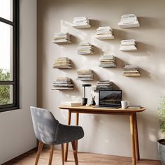 a desk with some books on it and a chair in front of the table next to it